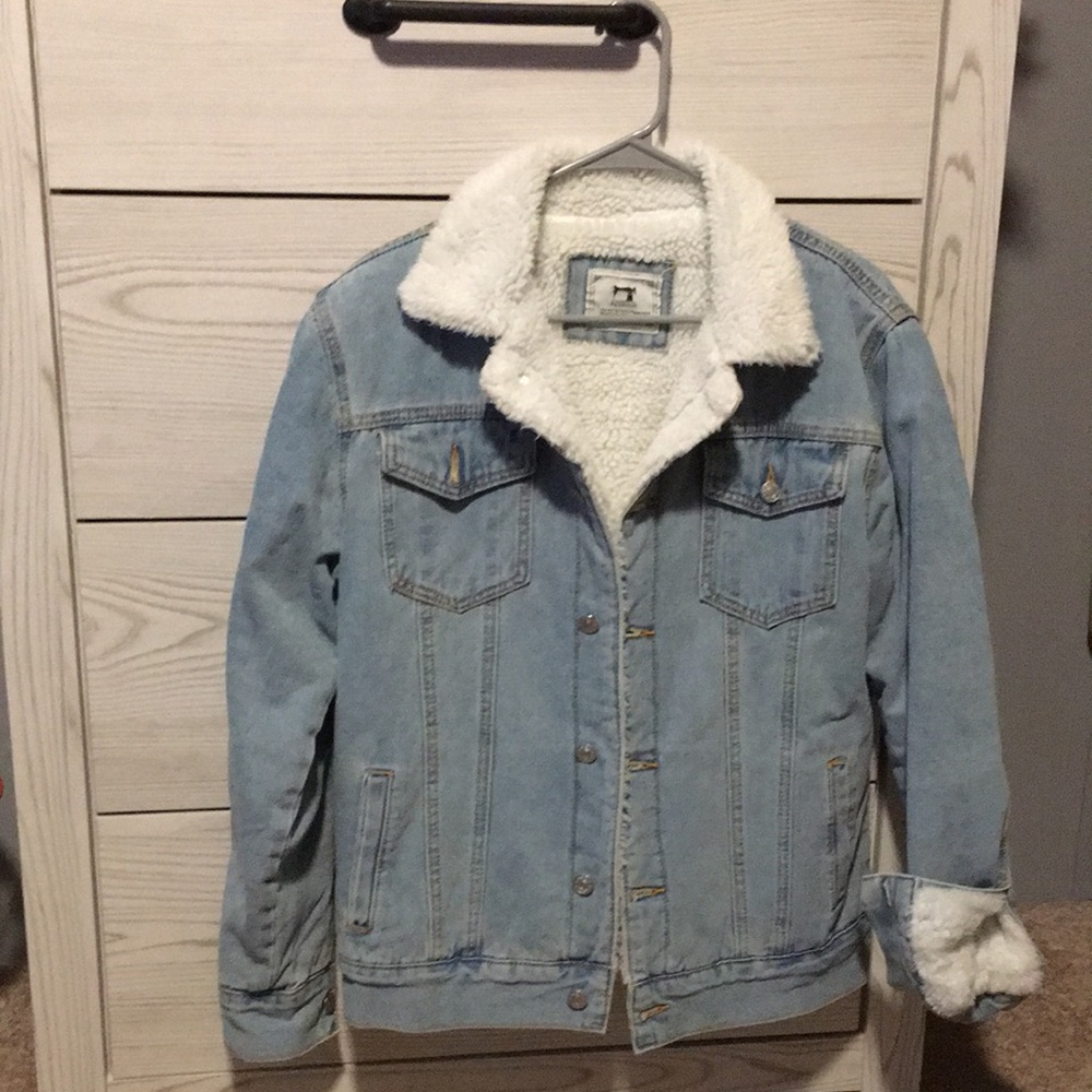 Mens denim jacket with white fleece inside.